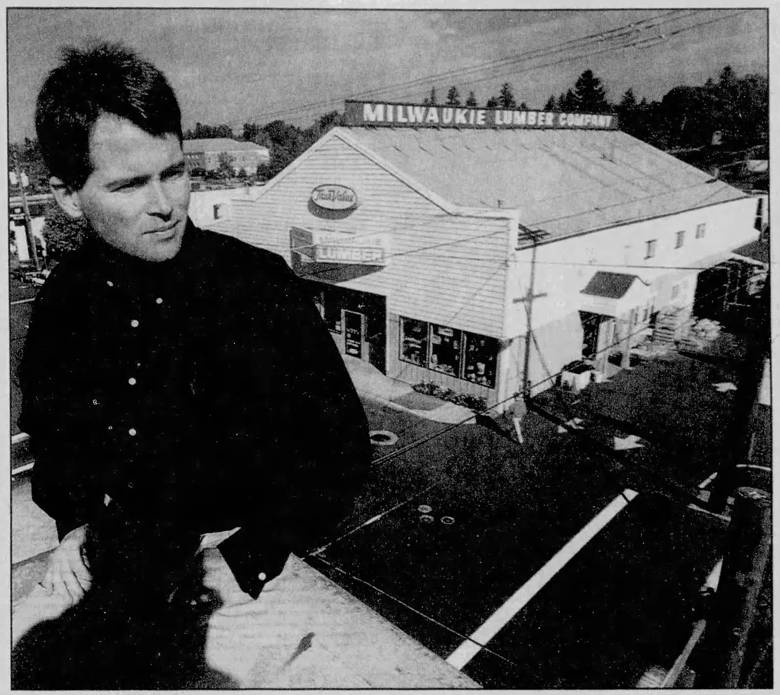 Steve Morse surveys the Milwaukie Lumber yard from a rooftop, October 1994