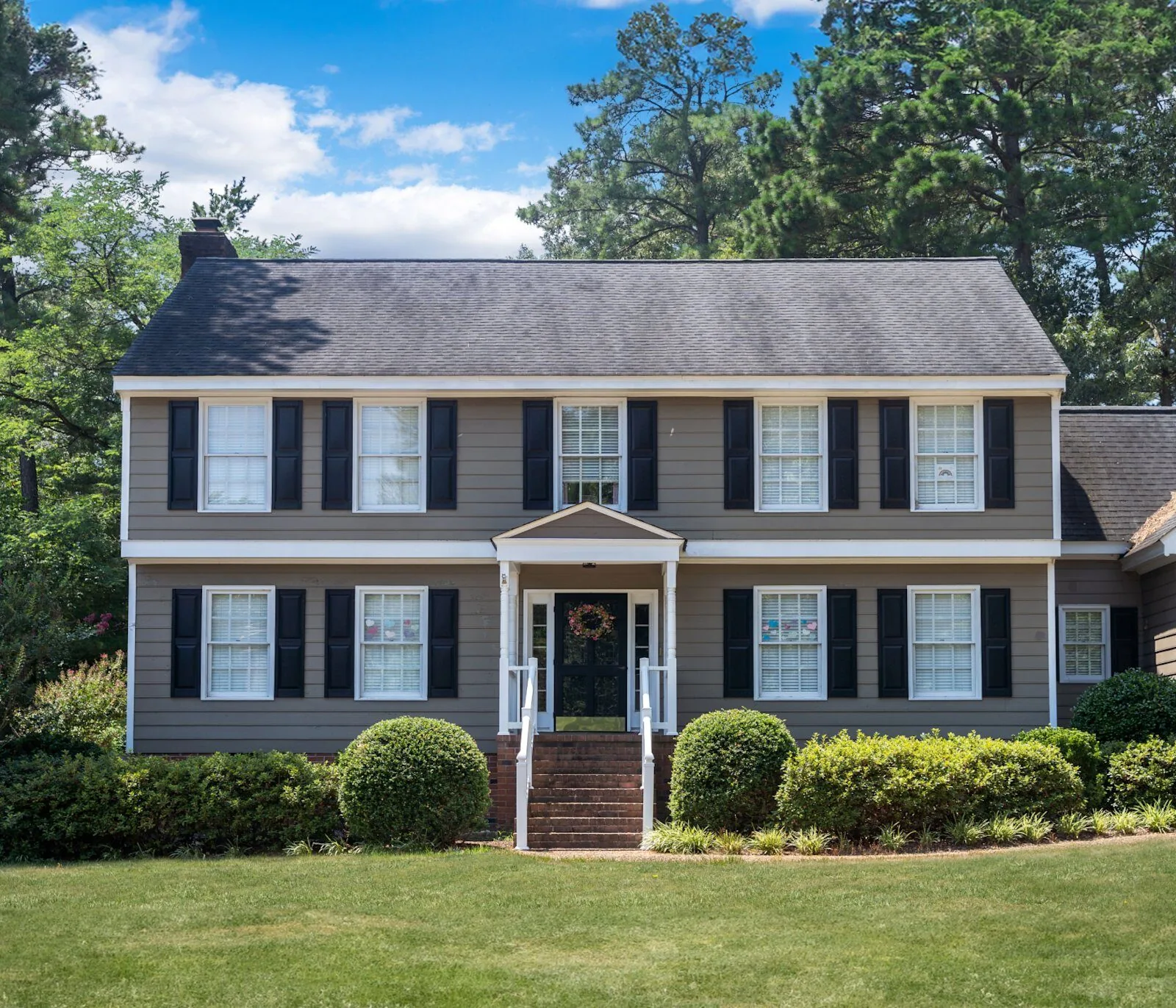 Colonial home with James Hardie HardiePlank siding in Night Gray