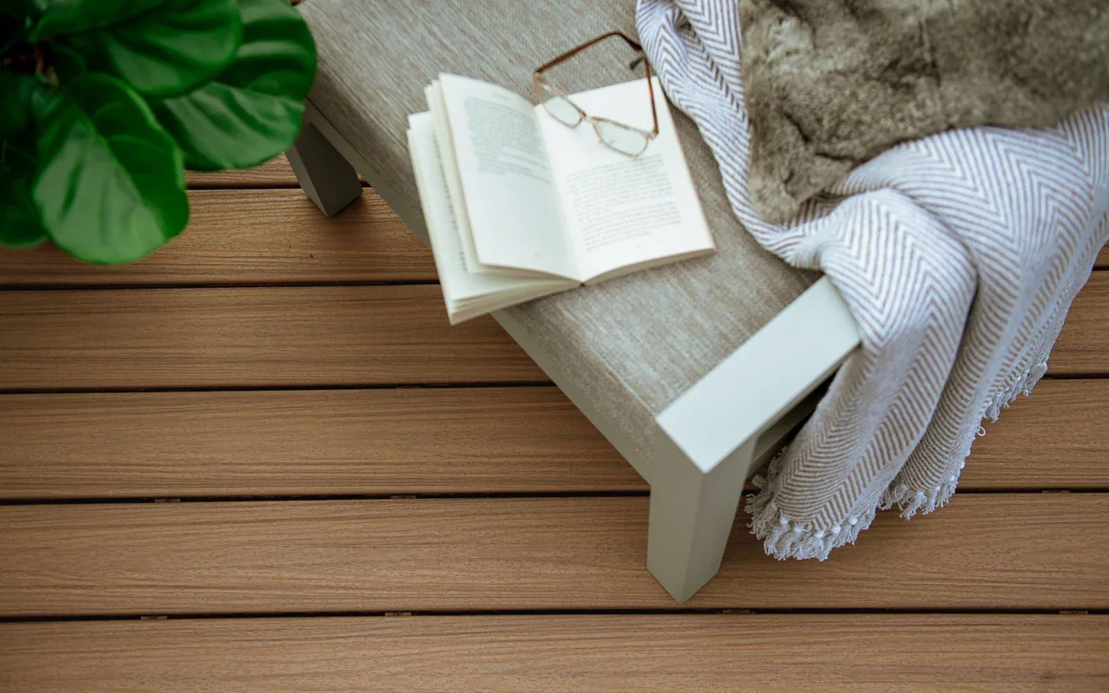 Trex Enhance Naturals decking in Golden Hour color with outdoor furniture